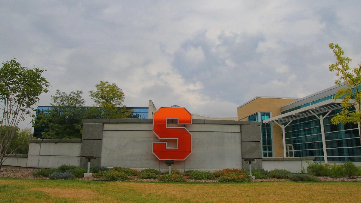 A building on Syracuse's campus showing an orange letter "S."