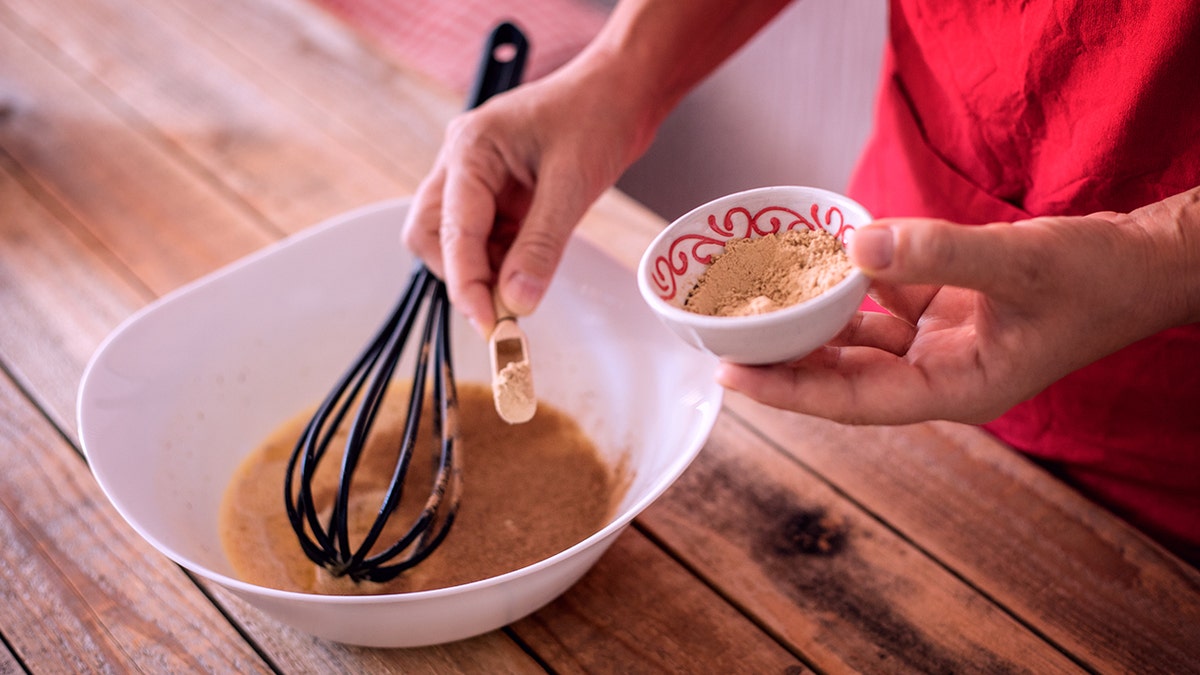 Pumpkin pie making, filling preparing, pouring spices