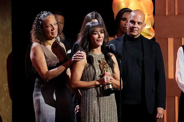 Martina Jones, from left, Rashida Jones, and Quincy Jones III accept a posthumous honorary award for Quincy Jones during the 15th Governors Awards at The Ray Dolby Ballroom in Los Angeles 