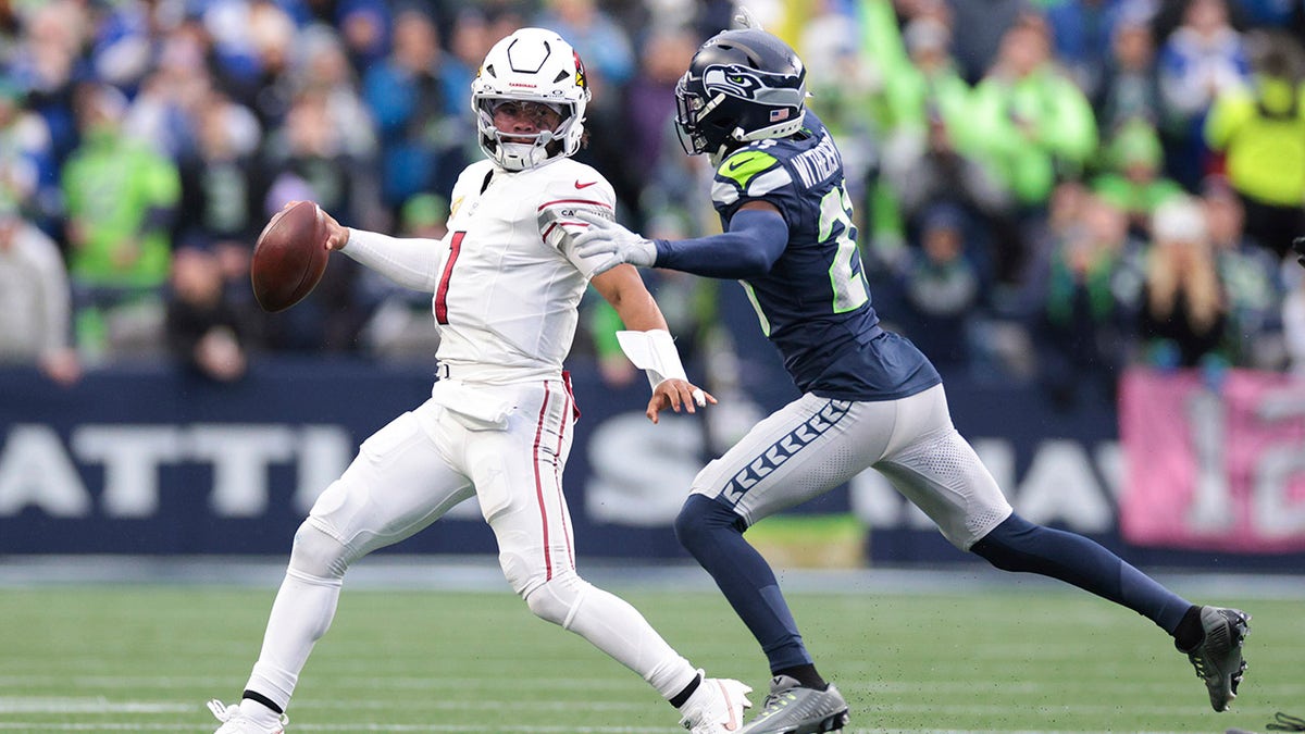 Kyler Murray looks to throw