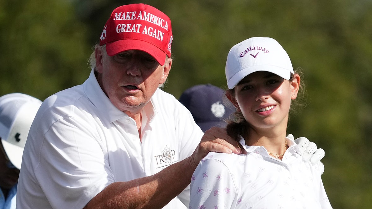 Donald and Kai Trump golfing