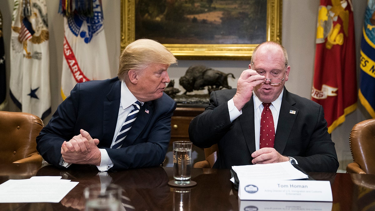 Then-President Trump, left, and acting Director of Immigration and Customs Enforcement Thomas Homan talk during a law enforcement roundtable on sanctuary cities in the Roosevelt Room at the White House on Tuesday, March 20, 2018 in Washington, D.C.