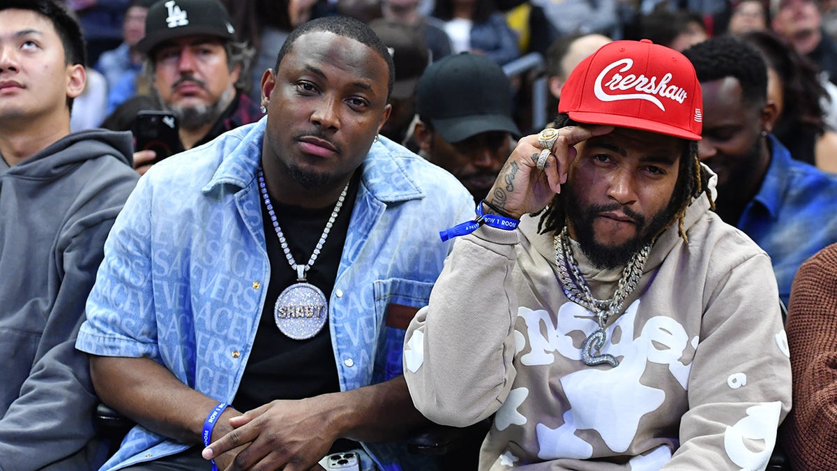 LeSean McCoy and DeSean Jackson pose courtside