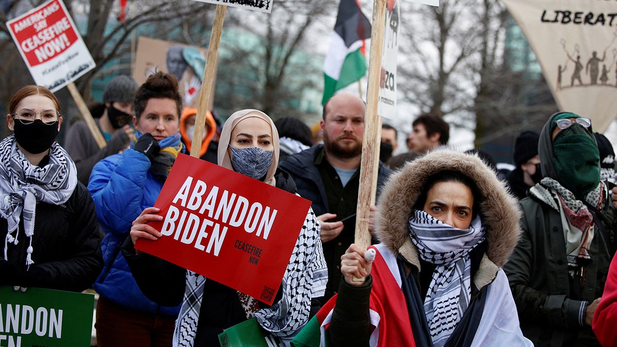 Protestors rally for a cease fire in Gaza outside a UAW union hall during a visit by President Joe Biden