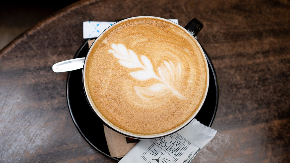 Cappuccino cup with flower. 