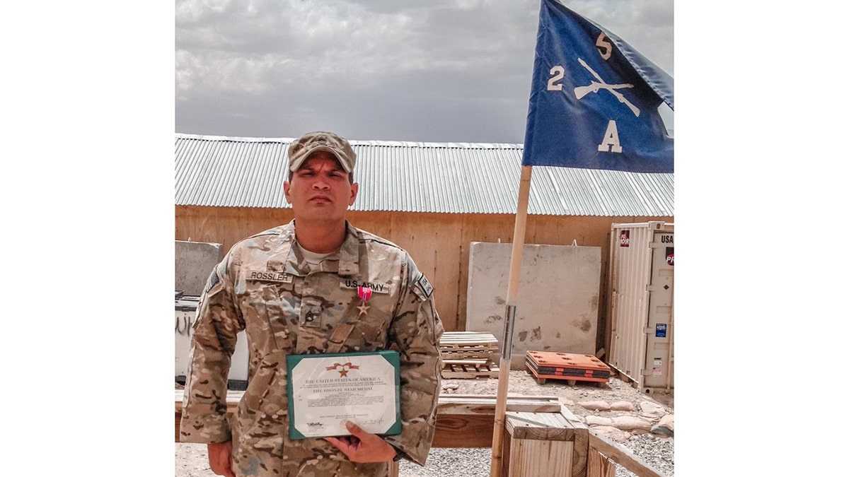 rossler receiving bronze award in the army