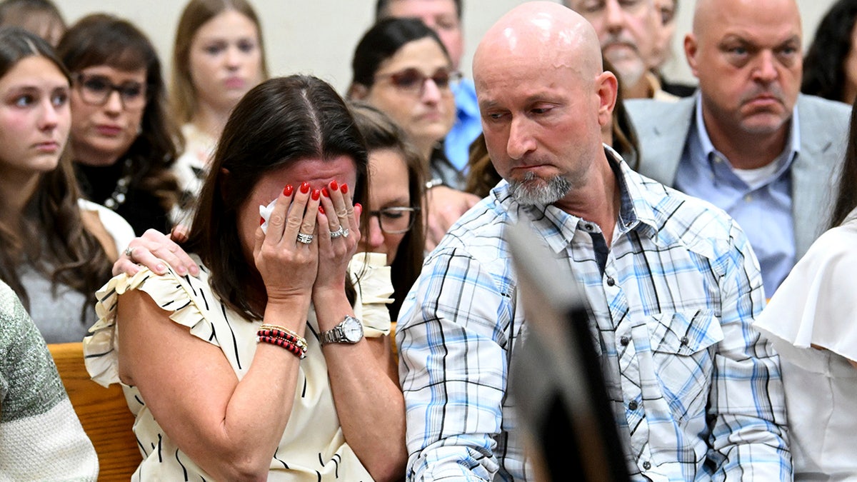 Allyson Phillips, left, mother of Laken Riley,a Georgia nursing student killed earlier this year, reacts as John Phillips, stepfather of Laken Riley, comforts her during Jose Ibarra's trial at Athens-Clarke County Superior Court, Friday, Nov. 15, 2024, in Athens, Ga.